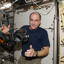NASA Astronaut Don Pettit hold one of the Full Spectrum cameras modified by Spencer's Camera & Photo.