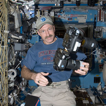 NASA Astronaut Dan Burbank hold one of the Full Spectrum cameras modified by Spencer's Camera & Photo.